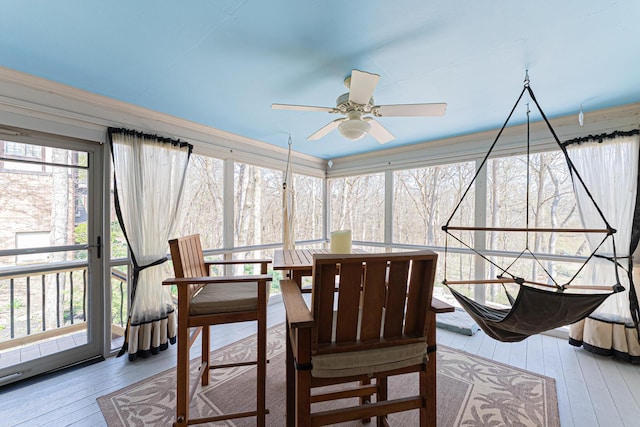 sunroom with hardwood / wood-style floors