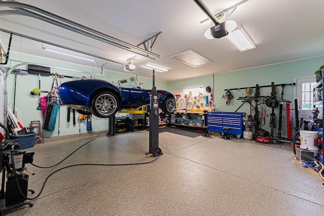 garage with a garage door opener and a workshop area