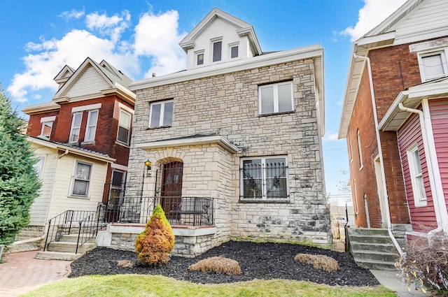 view of front of house with stone siding
