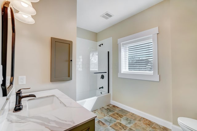 bathroom featuring vanity, shower / bath combination, toilet, baseboards, and visible vents