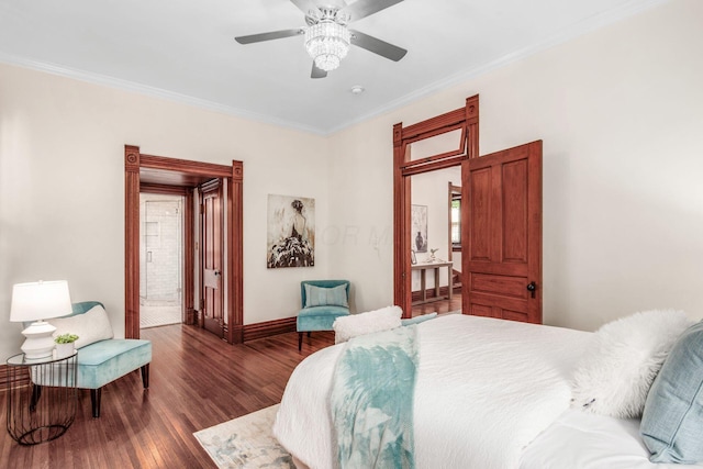 160 E Moler St, Columbus, OH 43207 - bedroom featuring baseboards, wood finished floors, crown molding, and a ceiling fan