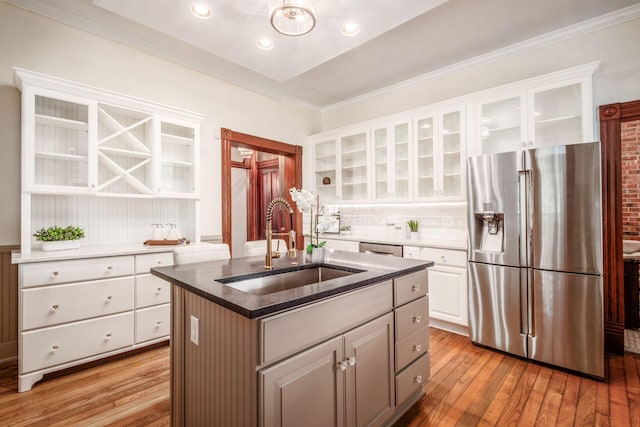 160 E Moler St, Columbus, OH 43207 - kitchen featuring stainless steel fridge, a sink, wood-type flooring, backsplash, and crown molding