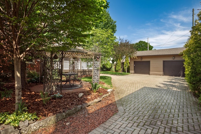 160 E Moler St, Columbus, OH 43207 - view of front of home featuring a gazebo, an outbuilding, a garage, and decorative driveway