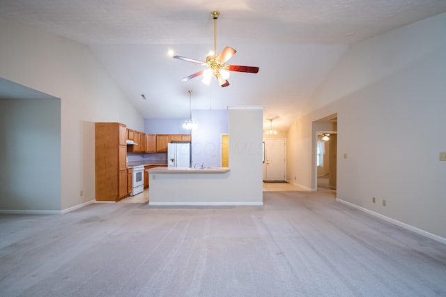 unfurnished living room featuring baseboards, ceiling fan, high vaulted ceiling, and light colored carpet