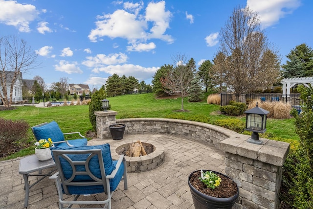 view of patio with a fire pit, fence, and a pergola