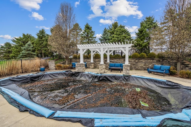 view of swimming pool featuring a fenced in pool, fence, a pergola, an outdoor hangout area, and a patio