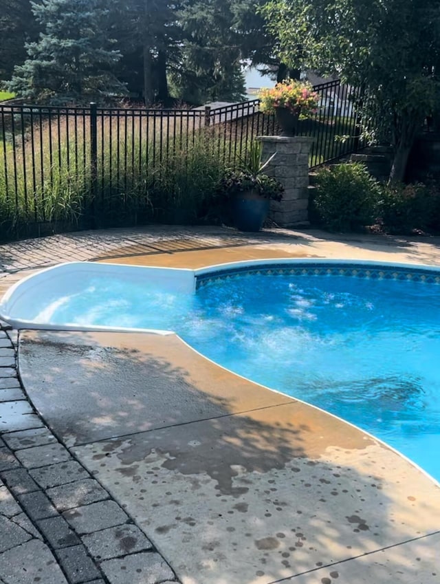 view of pool with fence and a fenced in pool