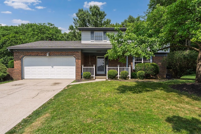 2520 Saltergate Dr, Dublin, OH 43016 - traditional-style house with concrete driveway, a garage, covered porch, and brick siding