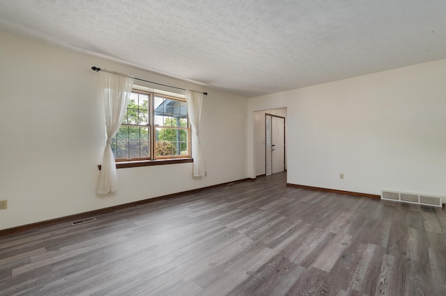 2520 Saltergate Dr, Dublin, OH 43016 - spare room with wood finished floors and a textured ceiling