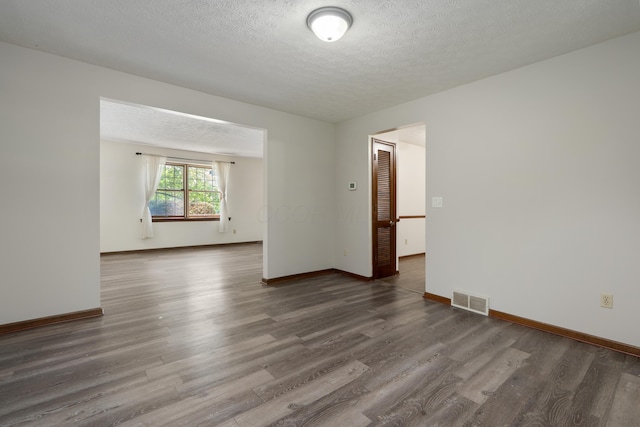 2520 Saltergate Dr, Dublin, OH 43016 - spare room featuring wood finished floors and a textured ceiling