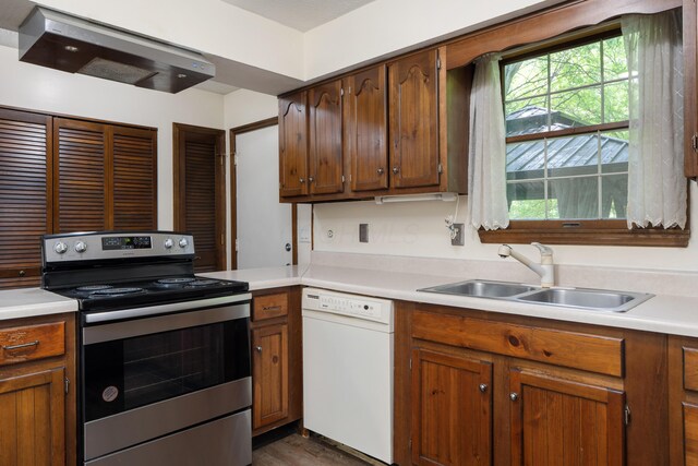 2520 Saltergate Dr, Dublin, OH 43016 - kitchen featuring white dishwasher, stainless steel electric range oven, light countertops, and extractor fan