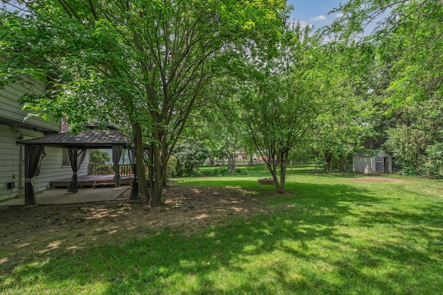 2520 Saltergate Dr, Dublin, OH 43016 - view of grassy yard featuring a gazebo, a storage unit, and a patio