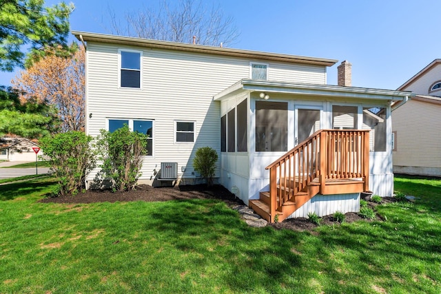 632 Tall Oaks Dr, Gahanna, OH 43230 - rear view of house with a sunroom, a yard, a chimney, and cooling unit
