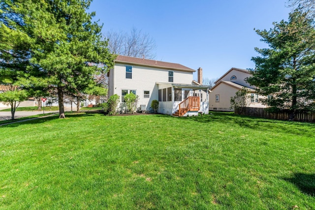 632 Tall Oaks Dr, Gahanna, OH 43230 - rear view of house featuring a sunroom, fence, and a yard