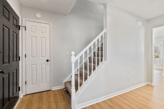 632 Tall Oaks Dr, Gahanna, OH 43230 - stairs with baseboards and wood finished floors