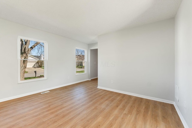 632 Tall Oaks Dr, Gahanna, OH 43230 - spare room featuring baseboards, visible vents, and light wood finished floors