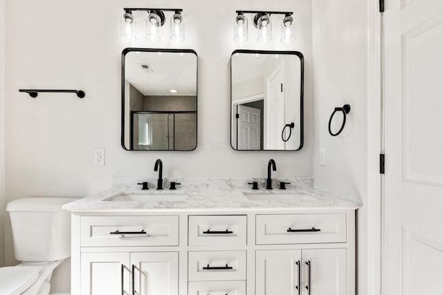 632 Tall Oaks Dr, Gahanna, OH 43230 - bathroom featuring a sink, a shower stall, toilet, and double vanity