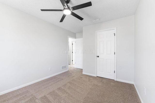 632 Tall Oaks Dr, Gahanna, OH 43230 - unfurnished bedroom with carpet floors, a textured ceiling, baseboards, and visible vents