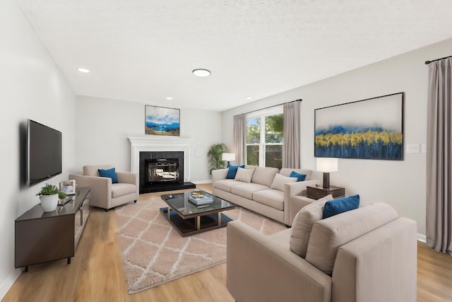 632 Tall Oaks Dr, Gahanna, OH 43230 - living room with recessed lighting, baseboards, light wood finished floors, and a fireplace