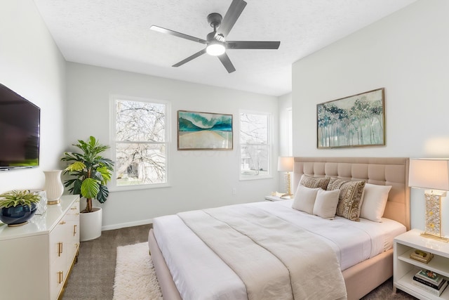 632 Tall Oaks Dr, Gahanna, OH 43230 - bedroom featuring dark carpet, a ceiling fan, a textured ceiling, and baseboards