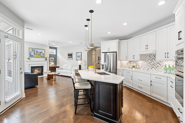 3325 Strickland Dr, New Albany, OH 43054 - kitchen with a ceiling fan, a sink, open floor plan, stainless steel fridge, and black electric stovetop