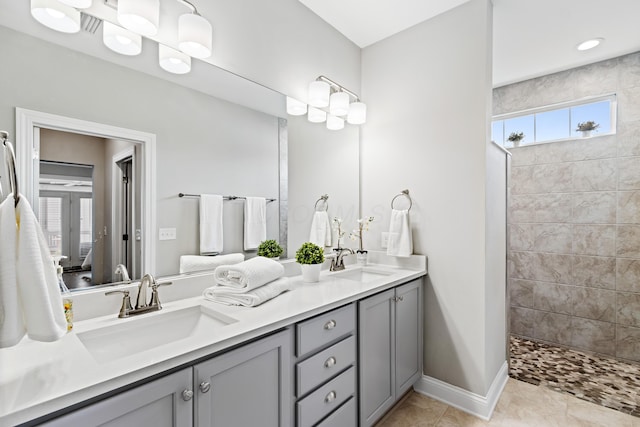 3325 Strickland Dr, New Albany, OH 43054 - bathroom featuring walk in shower, baseboards, a sink, and double vanity