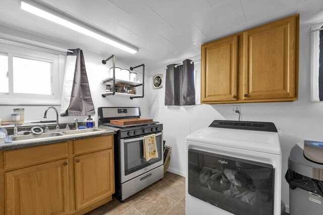 28 Elm St, Kingston, OH 45644 - kitchen featuring stainless steel gas range, a sink, visible vents, and washer / dryer