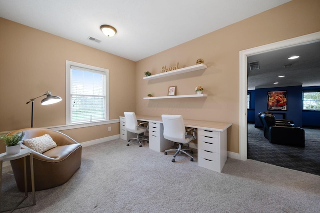 carpeted office featuring baseboards and visible vents