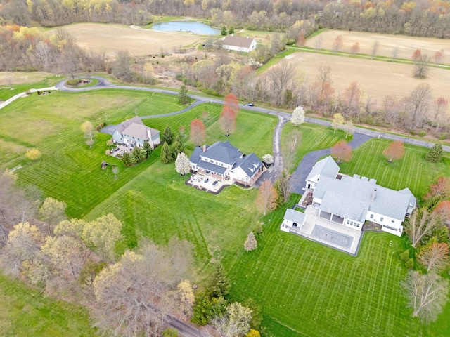 bird's eye view featuring a water view and a rural view