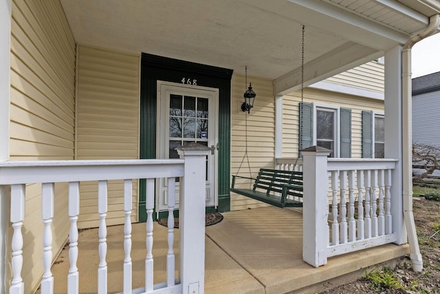 property entrance with covered porch