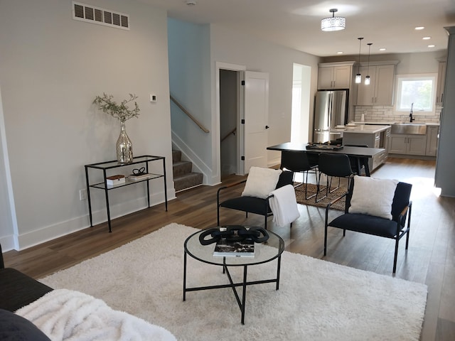 166 Miami Ave, Columbus, OH 43203 - living area with stairs, wood finished floors, and recessed lighting