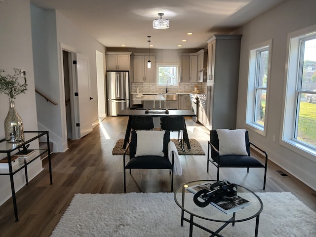 166 Miami Ave, Columbus, OH 43203 - living room with dark wood-style flooring and recessed lighting