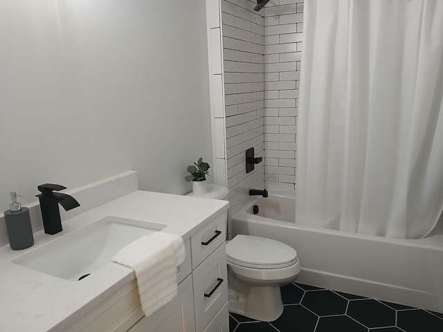 166 Miami Ave, Columbus, OH 43203 - full bathroom with vanity, shower / bath combo with shower curtain, and tile patterned floors