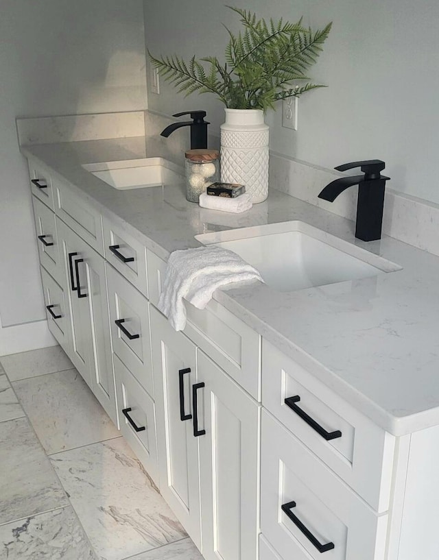 166 Miami Ave, Columbus, OH 43203 - bathroom with vanity and marble look tiles
