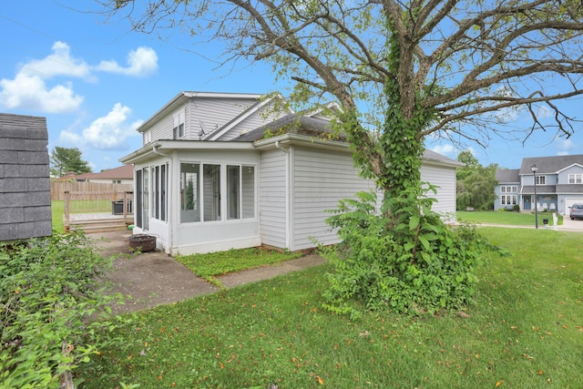 335 Mae St, Logan, OH 43138 - view of side of home featuring a sunroom
