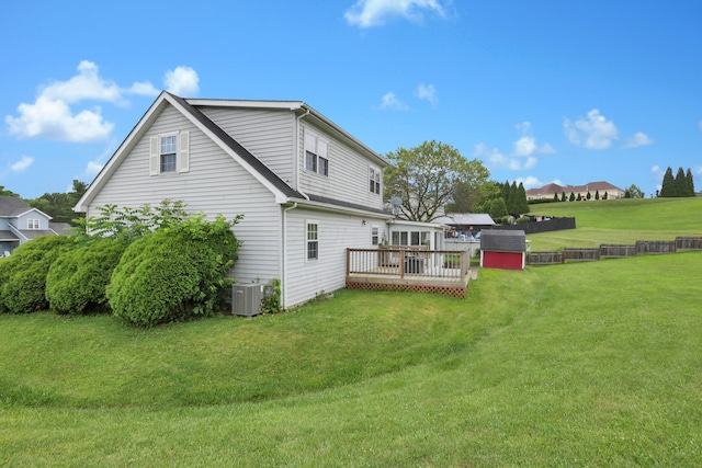 335 Mae St, Logan, OH 43138 - back of house with a deck, a storage unit, and a yard