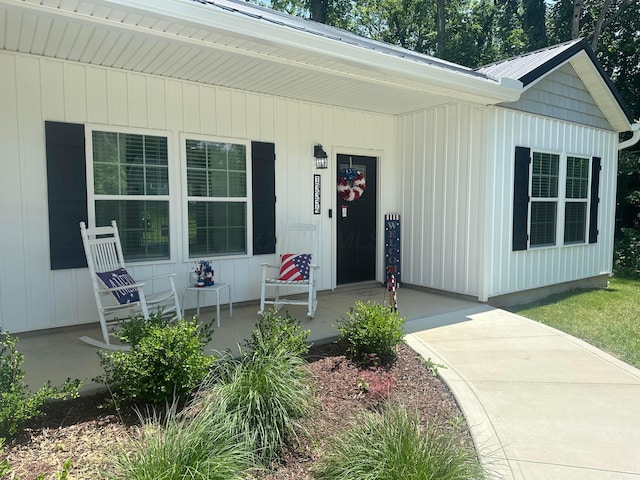 13334 Pine Rd NE, Thornville, OH 43076 - property entrance with a porch and a metal roof