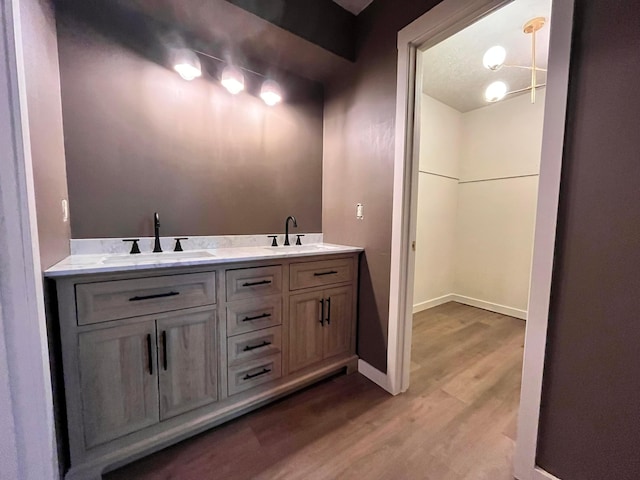 11795 Huntington Way NW, Pickerington, OH 43147 - full bathroom featuring wood finished floors, double vanity, and baseboards