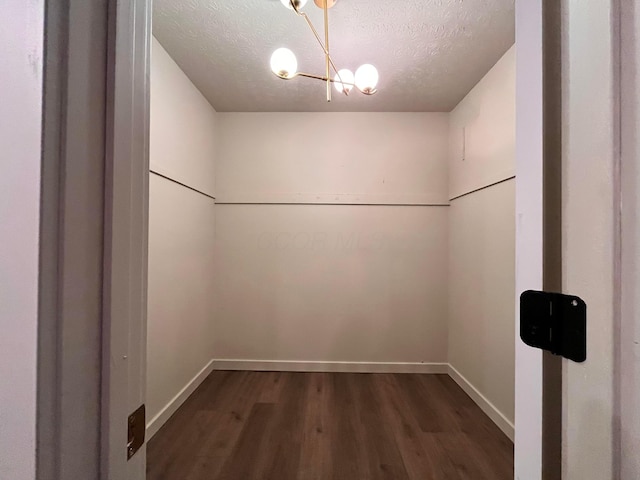 11795 Huntington Way NW, Pickerington, OH 43147 - spacious closet with dark wood-style floors and a chandelier