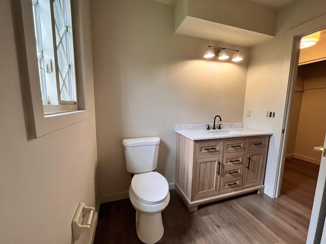 11795 Huntington Way NW, Pickerington, OH 43147 - bathroom with wood finished floors, toilet, vanity, and baseboards