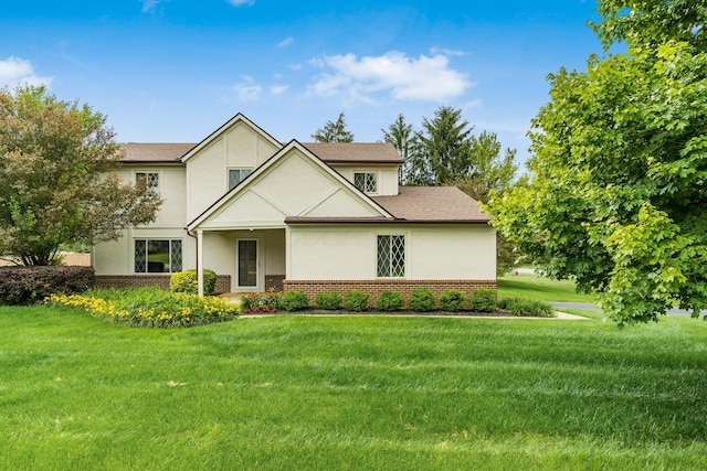 11795 Huntington Way NW, Pickerington, OH 43147 - view of front facade with brick siding, stucco siding, and a front lawn