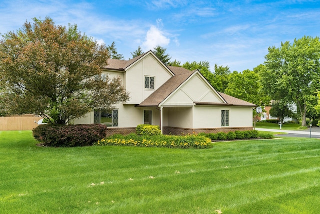 11795 Huntington Way NW, Pickerington, OH 43147 - view of front of property featuring stucco siding, brick siding, a front lawn, and a shingled roof