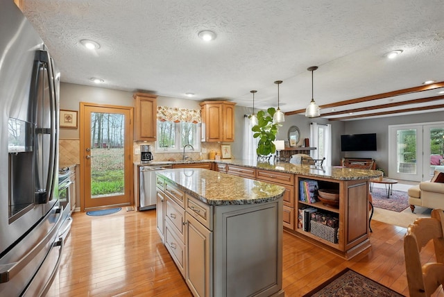 397 E Schrock Rd, Westerville, OH 43081 - kitchen with light wood-style flooring, a peninsula, stainless steel appliances, a sink, and open floor plan