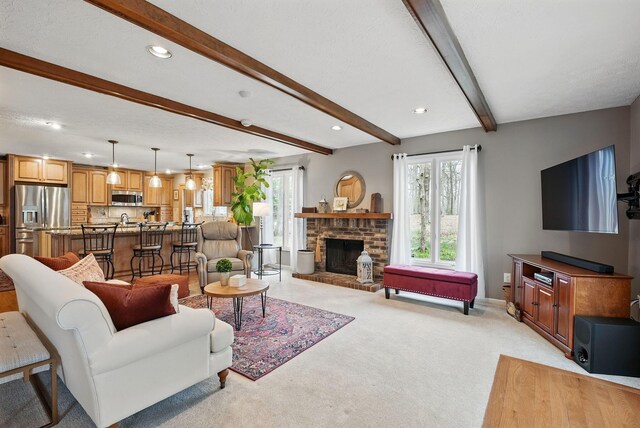 397 E Schrock Rd, Westerville, OH 43081 - living area featuring a brick fireplace, light carpet, beamed ceiling, and recessed lighting