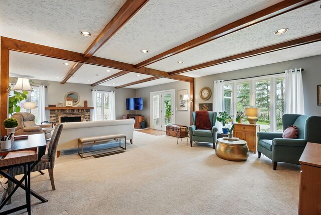 397 E Schrock Rd, Westerville, OH 43081 - living area featuring a brick fireplace, beam ceiling, light colored carpet, and a textured ceiling