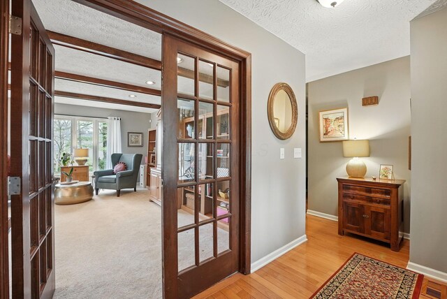 397 E Schrock Rd, Westerville, OH 43081 - doorway to outside with a textured ceiling, visible vents, light wood finished floors, baseboards, and french doors