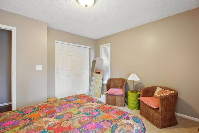 397 E Schrock Rd, Westerville, OH 43081 - bedroom with a closet, a textured ceiling, baseboards, and carpet