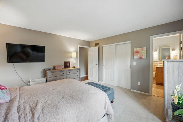 397 E Schrock Rd, Westerville, OH 43081 - bedroom with light colored carpet, ensuite bathroom, baseboards, visible vents, and a closet