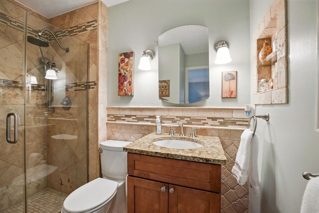 397 E Schrock Rd, Westerville, OH 43081 - bathroom featuring a stall shower, toilet, vanity, and tile walls