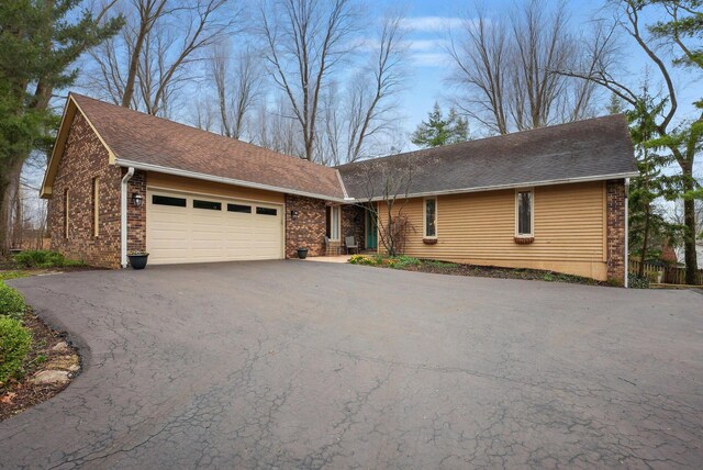 397 E Schrock Rd, Westerville, OH 43081 - ranch-style home with brick siding, aphalt driveway, and an attached garage